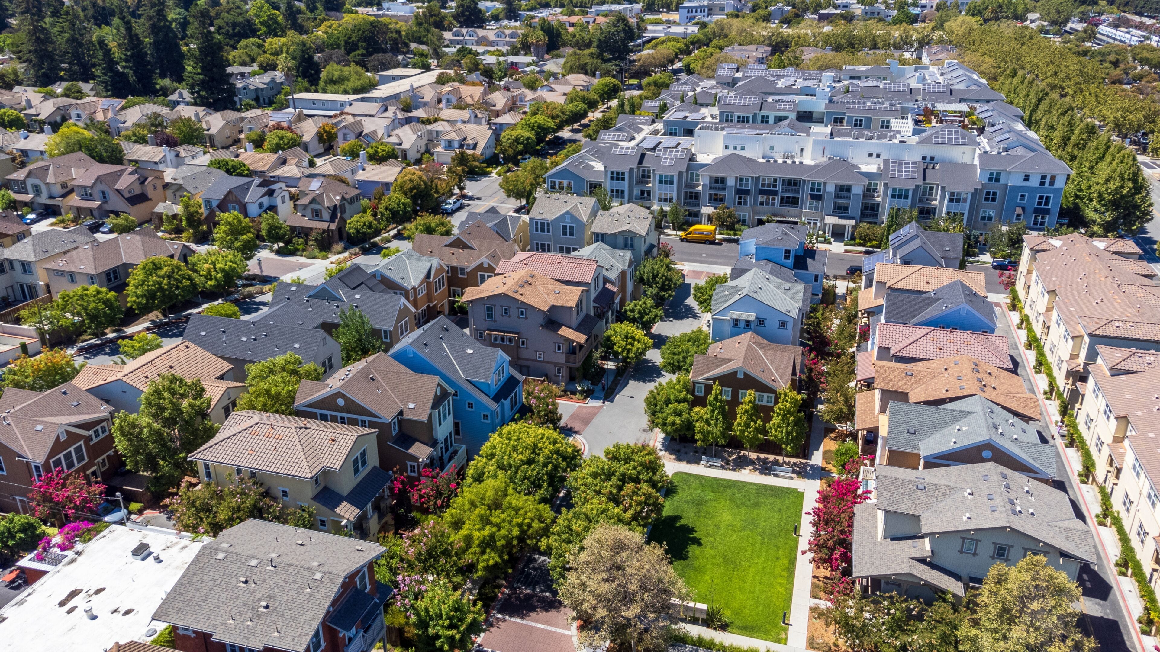 Aerial drone view of dense modern suburban residential neighborhood in Mountain View, California