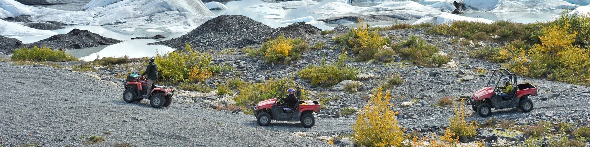 Palmer showing mountains and off road driving as well as a small group of people