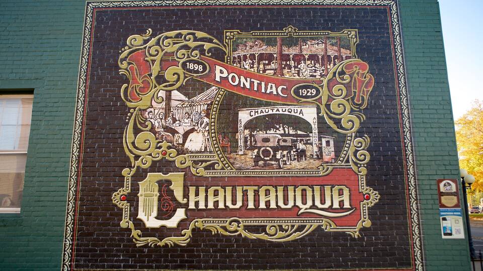 A mural with the text "Pontiac 1898" and "Chautauqua 1929" on a brick wall.