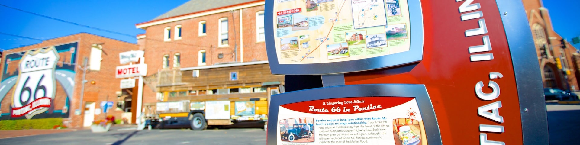 Pontiac caracterizando sinalização e uma cidade