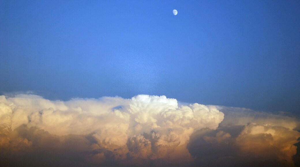 The moon reigns over the storm.