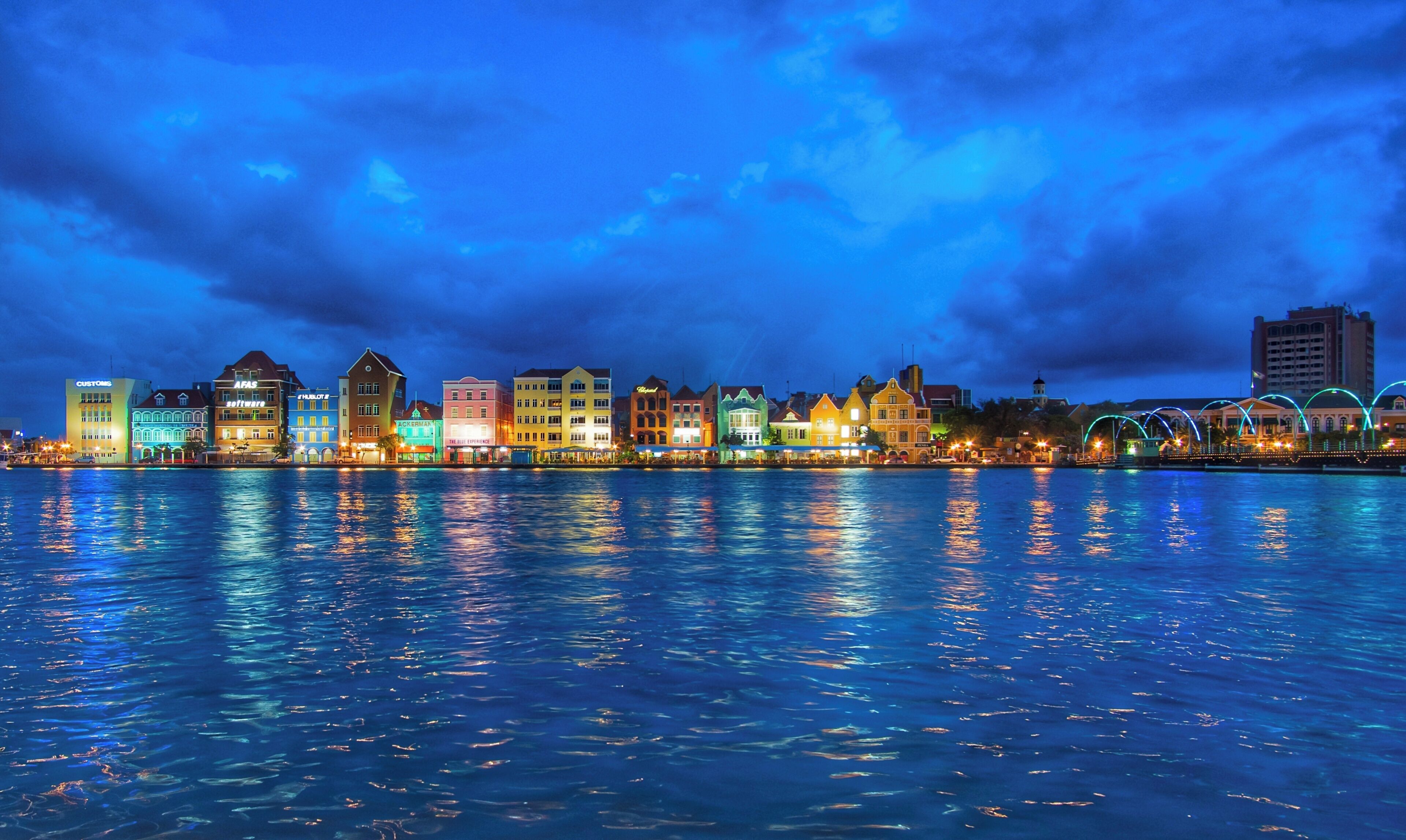 The harbor view in the port area of Willemstad at night