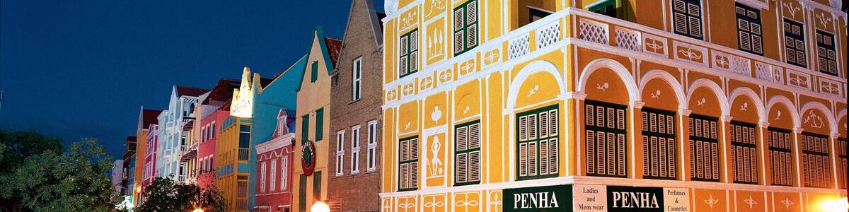 Willemstad showing night scenes, a city and street scenes
