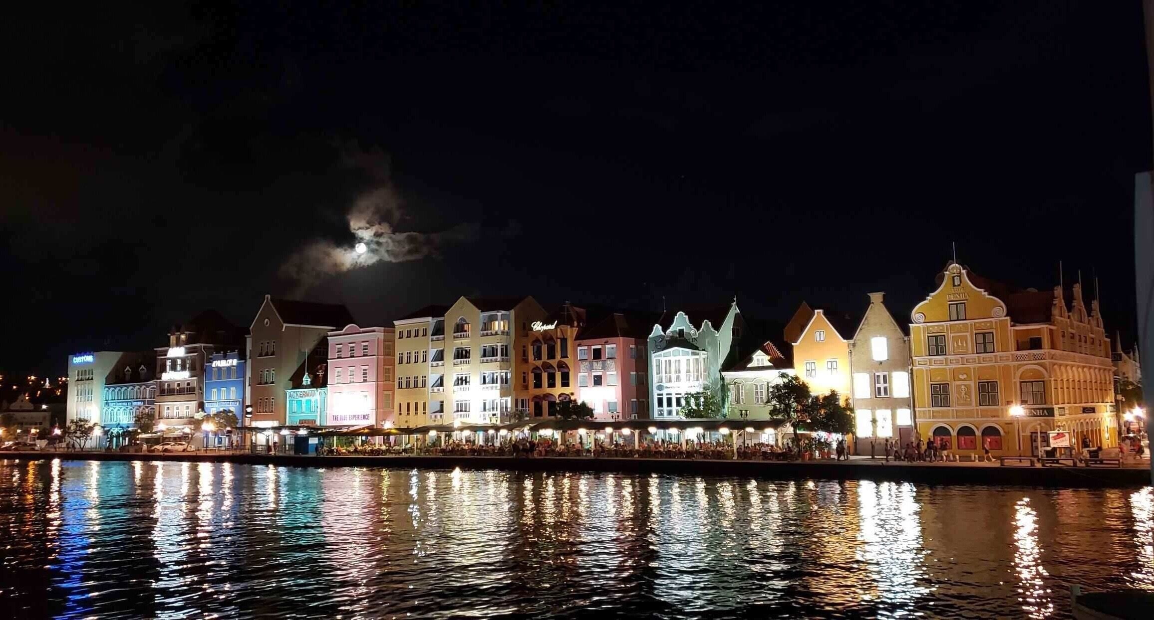 Candy colored houses under the moonlit sky