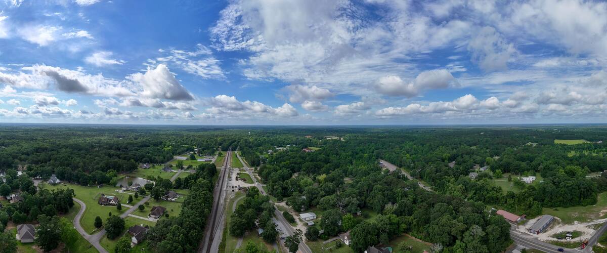 A river, a highway, and a dense forest.