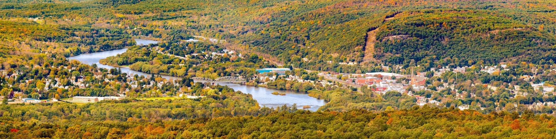 Aerial view of the City of Port Jervis, NY crossed by Upper Delaware river as viewed from High Point peak, NJ