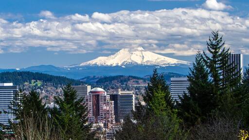 Portland, Oregon; View of snow covered Mt Hood and buildings in downtown Portland, Oregon