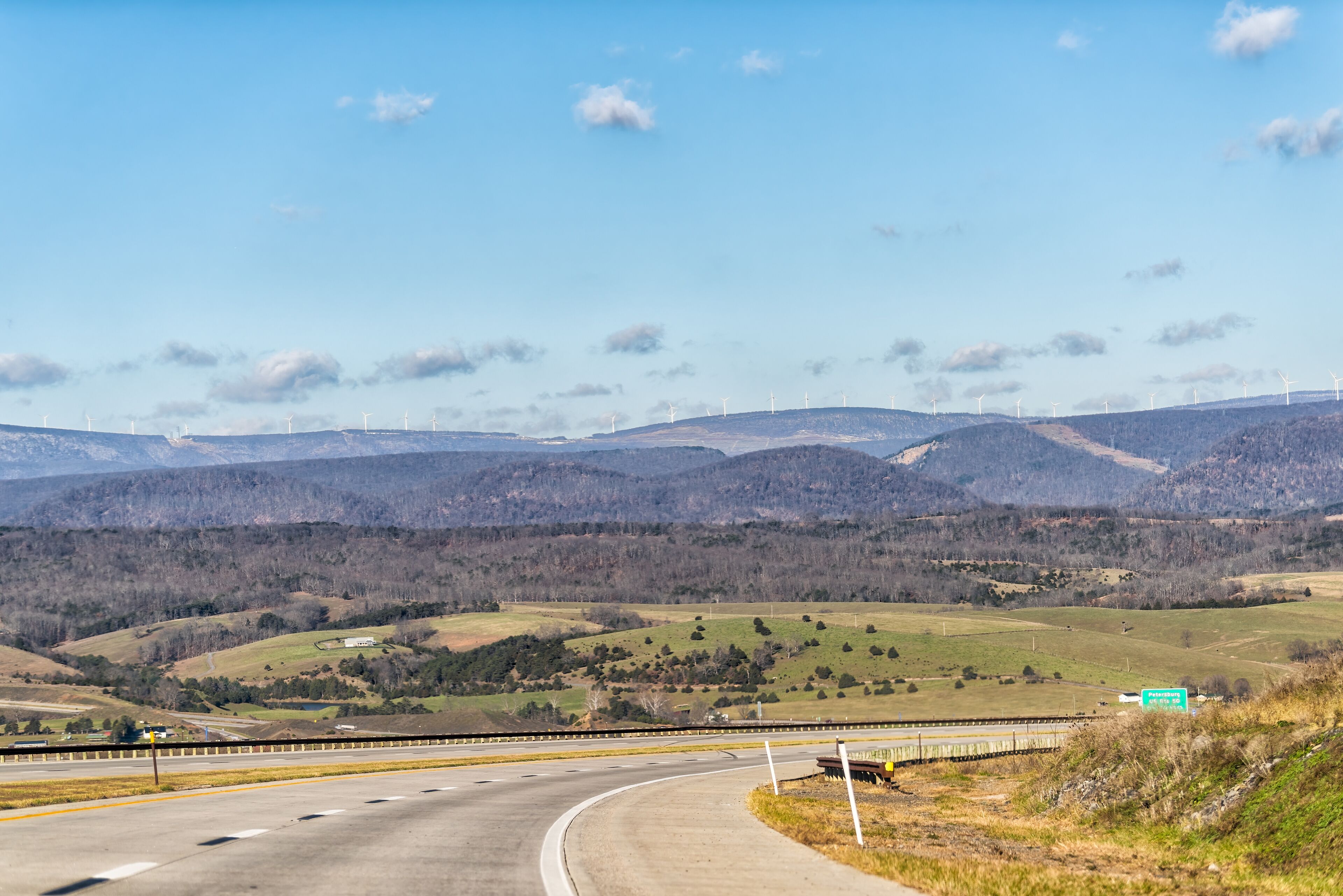Wind turbines windmills on top of Appalachian mountains in West Virginia Canaan valley scenic landscape view in winter