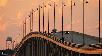 Barron Collier Bridge and Gilchrist Bridge in Florida with moving traffic. Transportation infrastructure in Charlotte County connecting Punta Gorda and Port Charlotte over Peace River