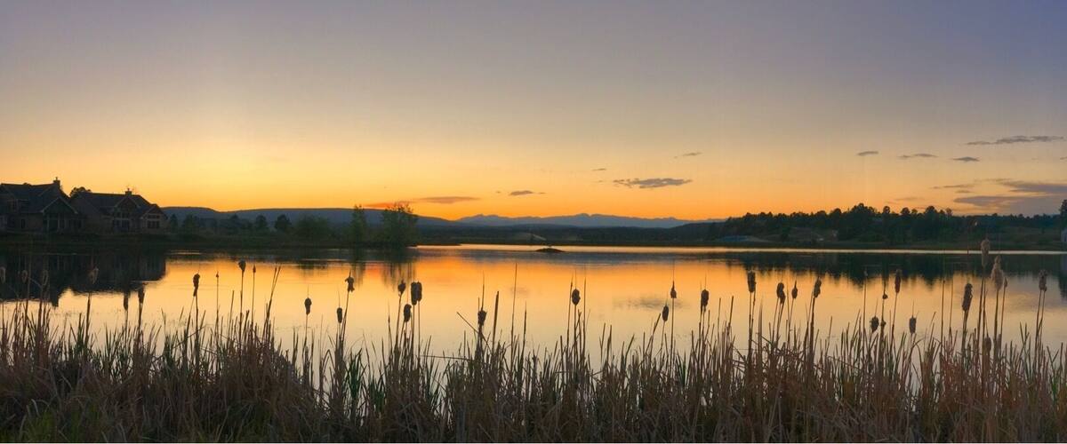 Sunset over the lake in Pagosa CO. Pagosa Springs has an amazing hot spring resort on the river with many tubs cut into the riverside of different temperatures and salinity. Above the old town of Pagosa Springs is a newer development the has a lake with an view towards Pagosa Peak and the Window area of the Continental Divide. There are also hot springs located hidden away in the mountains in this picture ( Rainbow hot springs). In case you are interested photo taken with an iPhone