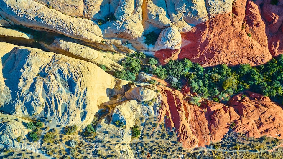 Aerial Top Down of Vibrant Red Rock Canyon Desert Landscape