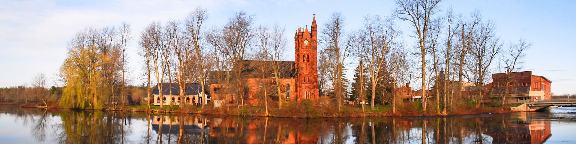 Red brick church at sunrise on the Racquette River, Potsdam, NY