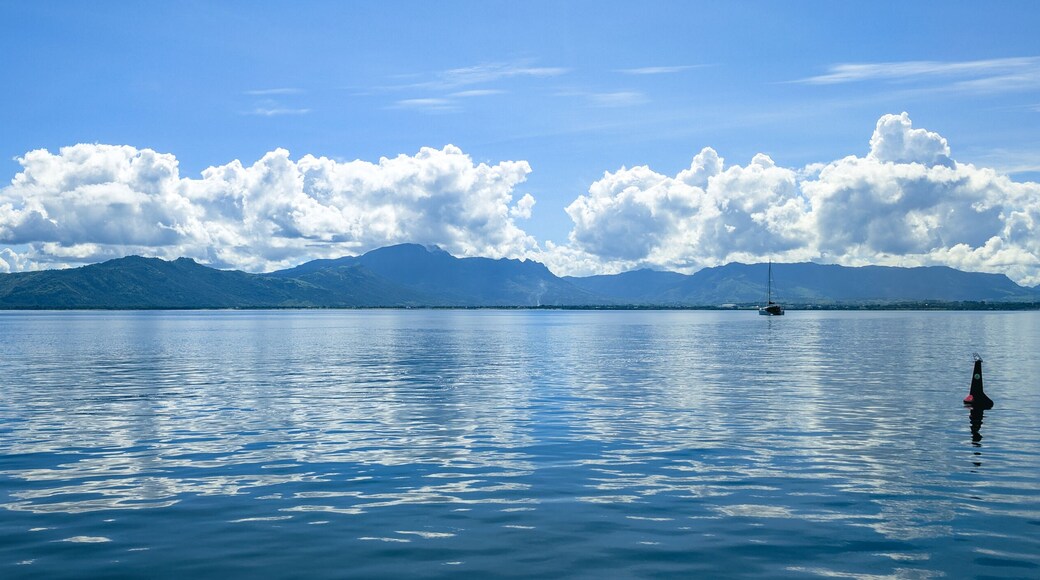 Panoramic View of Viti Levu, Fiji with a Sailboat on a Calm Sea