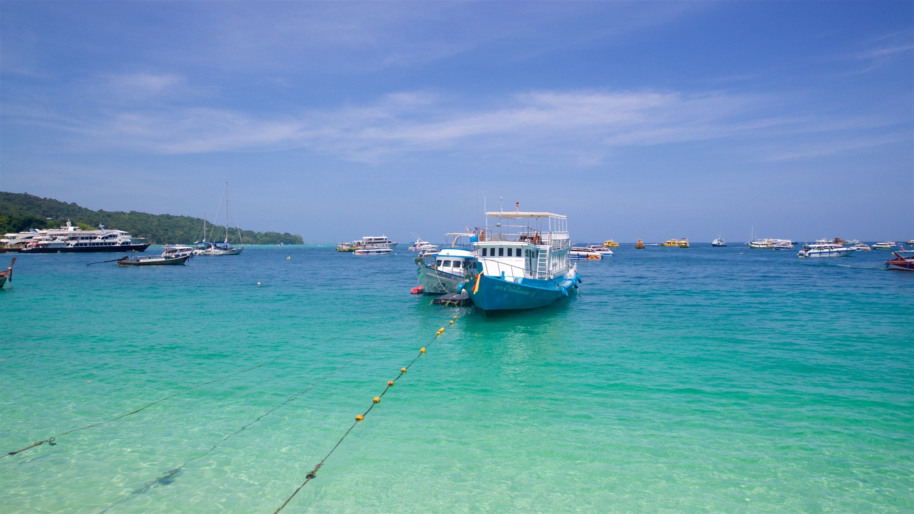 Ko Phi Phi which includes tropical scenes, general coastal views and a bay or harbor