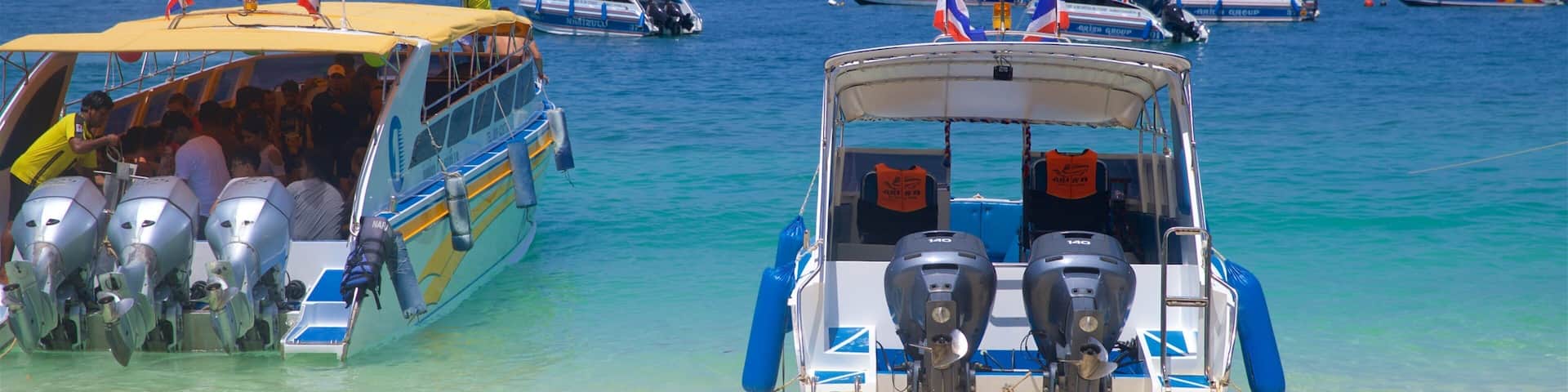 Ko Phi Phi which includes tropical scenes, a beach and general coastal views