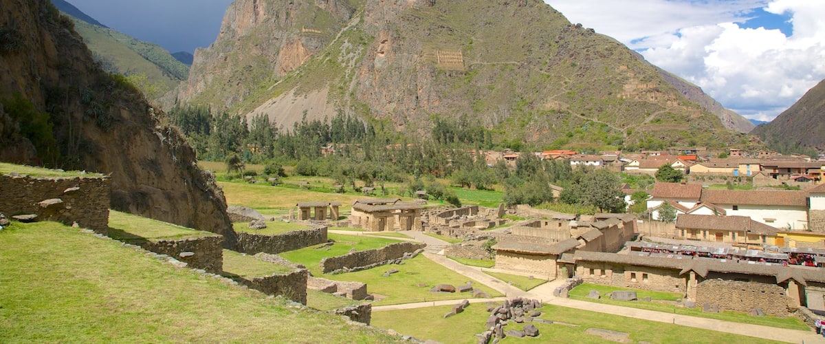 A mountainous landscape with ancient ruins and a village.