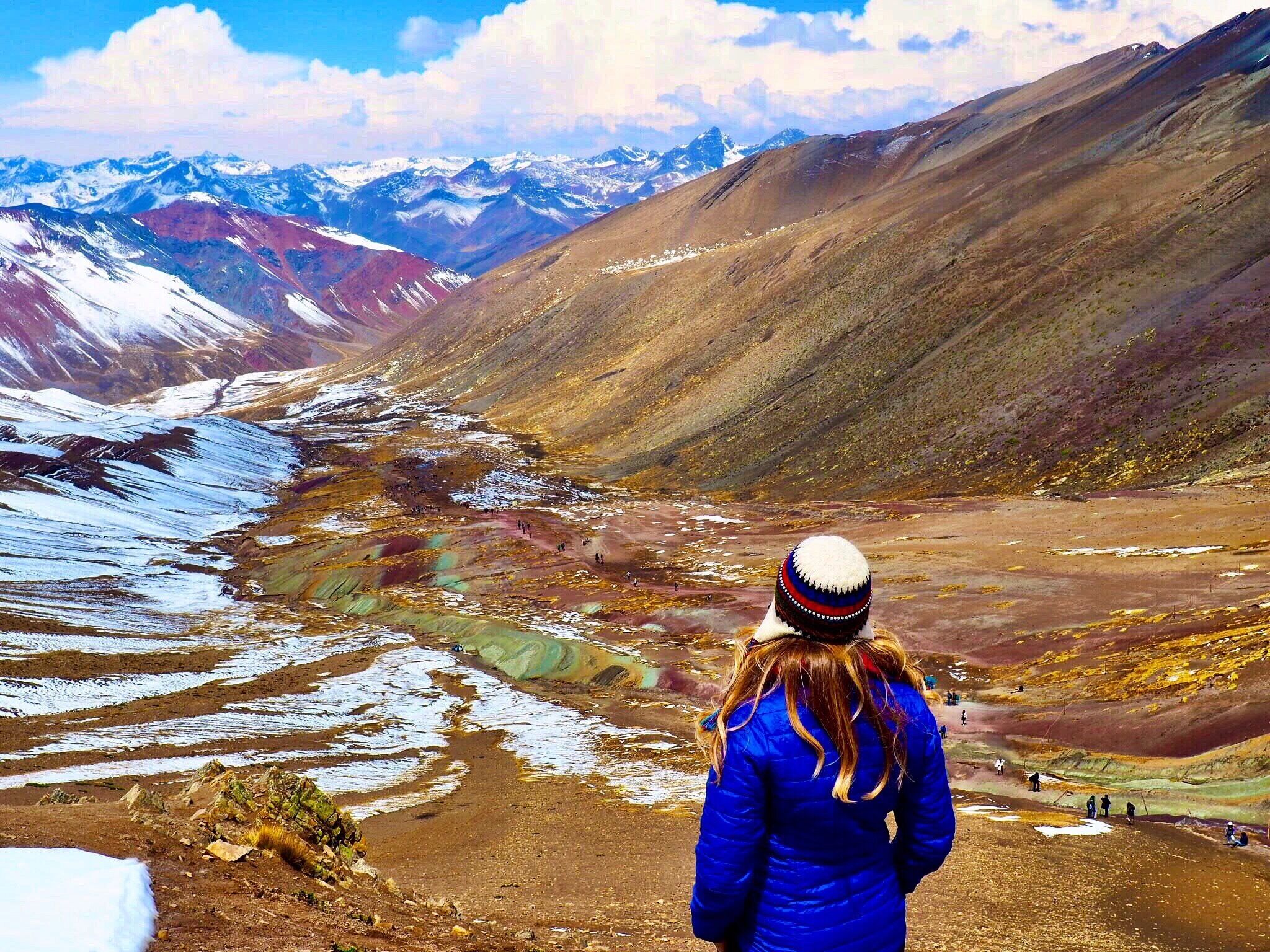 Overlooking the extraordinary hike I just finished to reach the summit of Rainbow Mountain in Peru