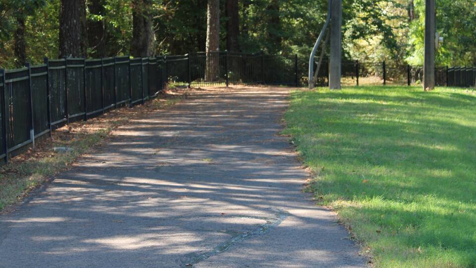Walking and jogging path lined with trees located in jackson mississippi