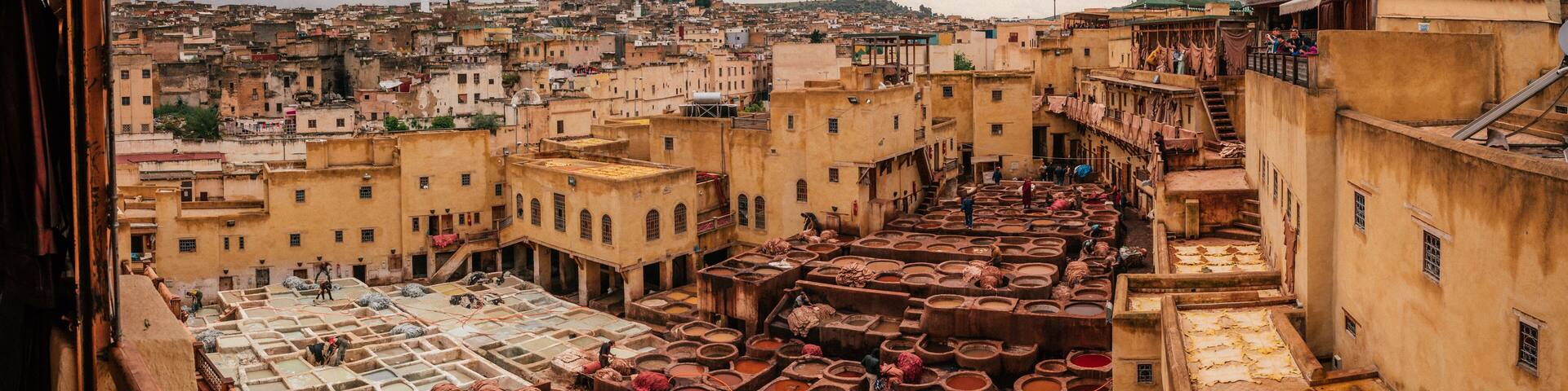 View inside of old medina in Fes, a traditional and old tannery with workers working making methods of leather in the city Fes, Morocco, in april of 2019.