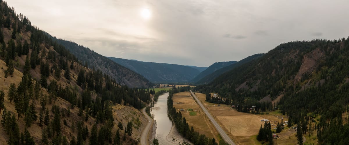 Aerial Panoramic View of a scenic Highway in the Valley surrounded by Canadian Mountain Landscape. Taken near Princeton, British Columbia, Canada.