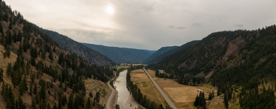 Aerial Panoramic View of a scenic Highway in the Valley surrounded by Canadian Mountain Landscape. Taken near Princeton, British Columbia, Canada.