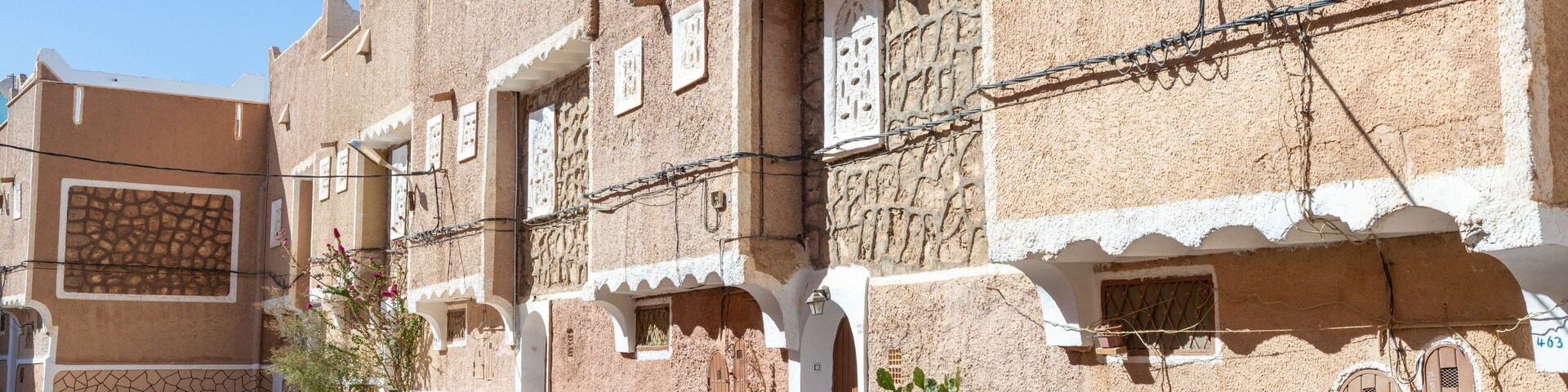 Traditional architecture of Ghardaïa, Algeria – View of the mud houses and minaret of the old town