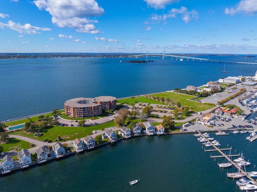 Goat Island aerial view including Goat Island Marina and Newport Harbor Island Resort with Claiborne Pell Newport Bridge at the back in Narragansett Bay, Newport, Rhode Island RI, USA.