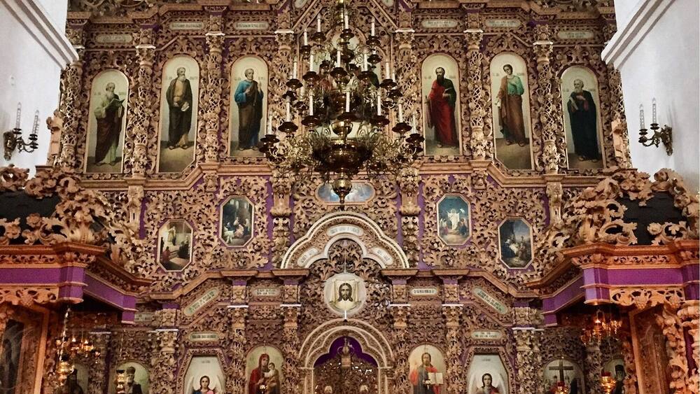 Instead of gold covered, the iconostasis and everything inside the church is delicate, intricately carved wood.
