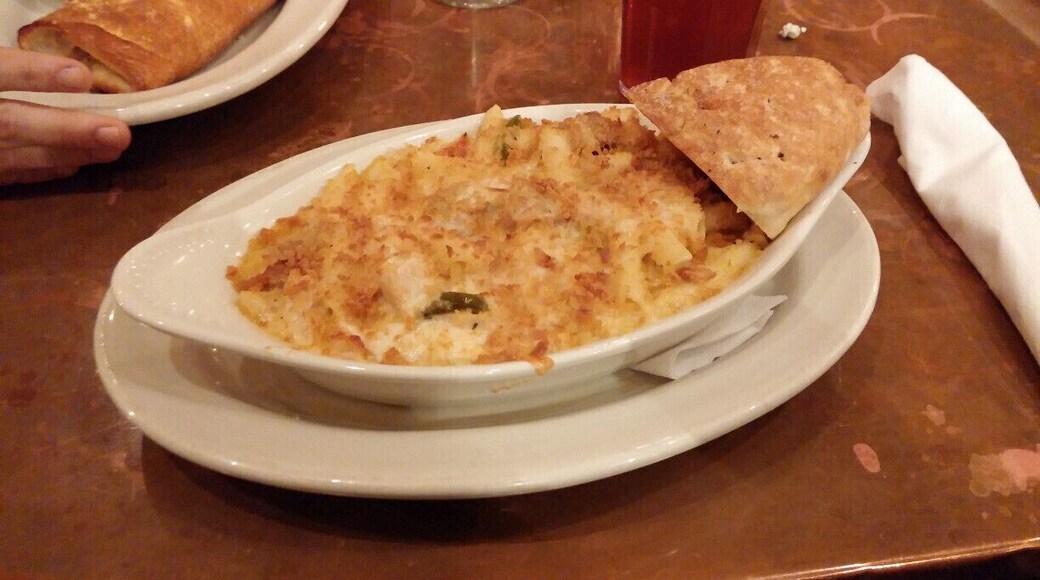 Creole Mac & Cheese: Andouille sausage, roasted chicken, caramelized onions, red and green bell peppers and mozzarella, topped with panko bread crumbs