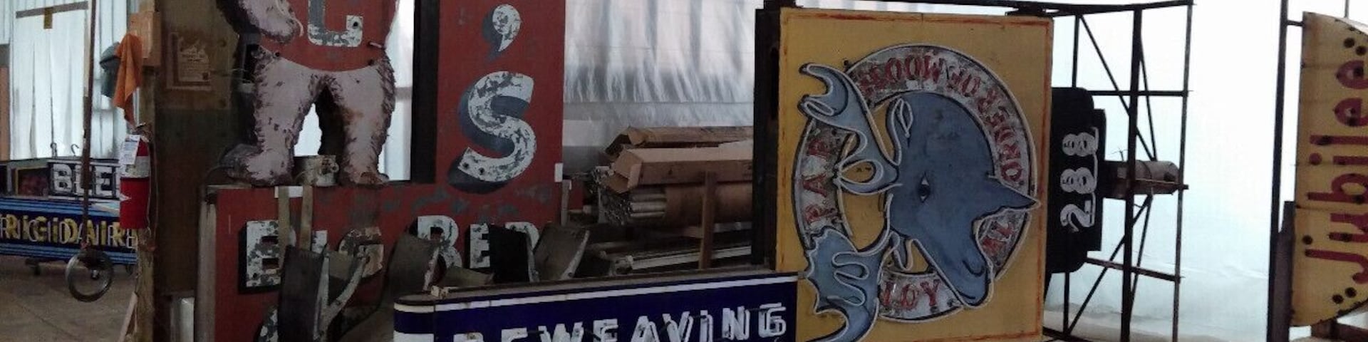 Behind the scenes at the American Sign Museum. An entire second space as big as the museum itself, full of signs awaiting the restoration process!