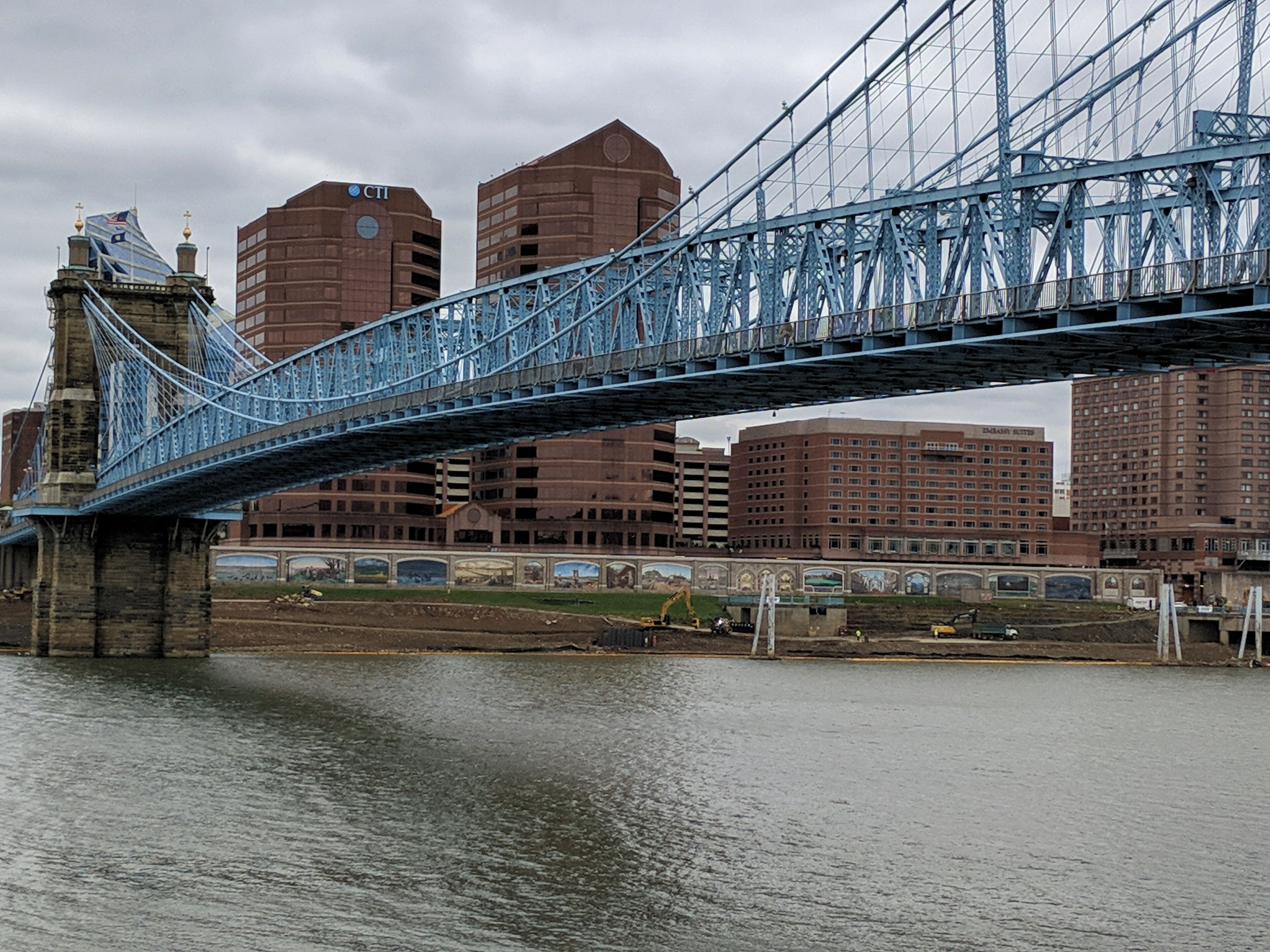 View of some murals across the Ohio River under a very cool bridge! #localsecrets #ohio