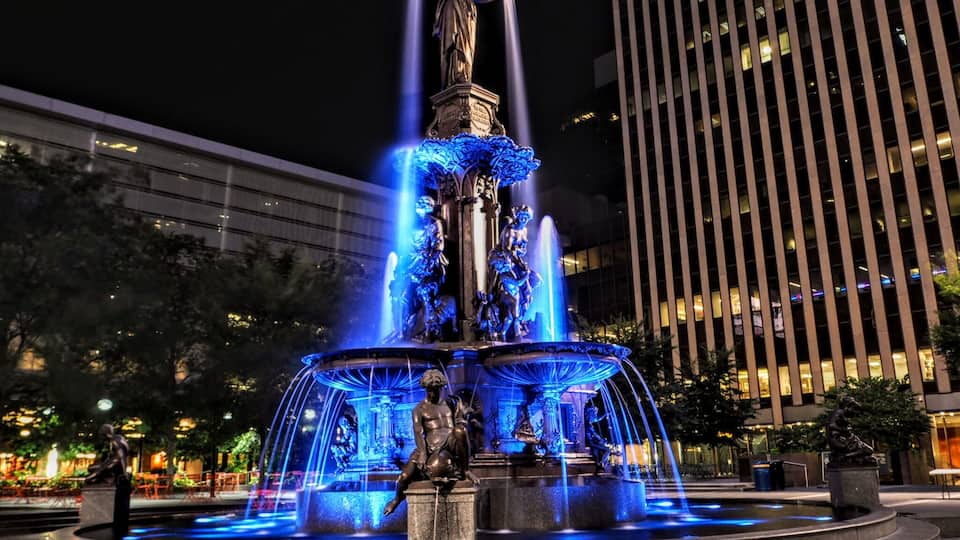 The Tyler Davidson Fountain was dedicated in 1871 and is located at Fountain Square in Cincinnati, Ohio.
The 43ft tall bronze and granite fountain is topped by a sculpture of the Genius of Water from which water cascades down.