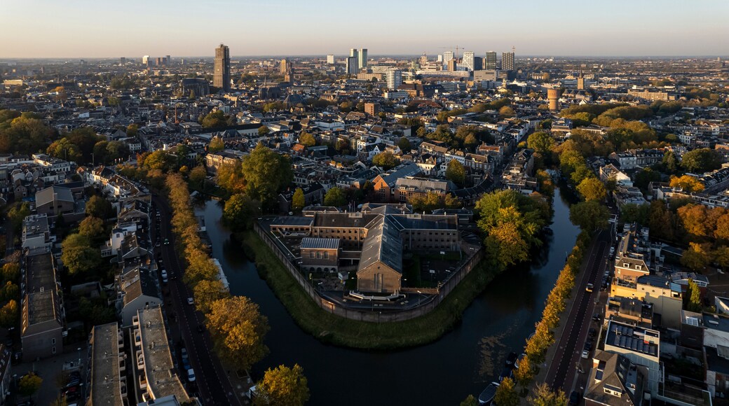 Cityscape skyline of medieval city Utrecht in The Netherlands with De Lik former prison for women in the foreground in autumn sunrise