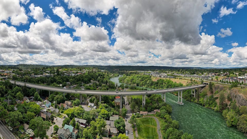 Panorama view of Spokane, WA cityscape with view of Maple St Bridge and Spokane River during the day, United States