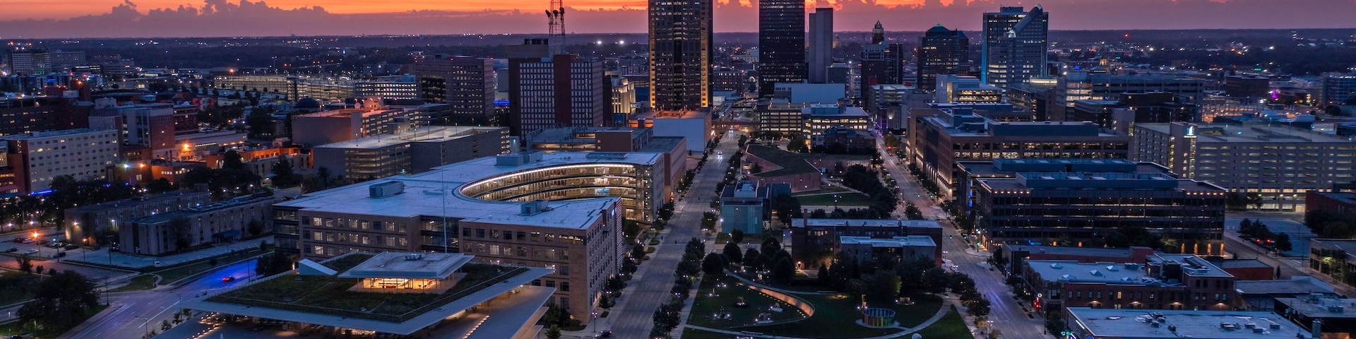 Western Gateway sunrise aerial looking downtown over Pappajohn Sculpture Park and Krause Gateway Center.