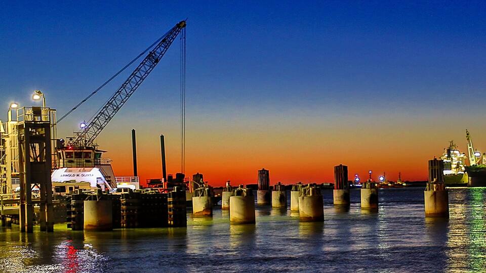 Port Aransas, Texas - 9-28-2024. Port Aransas at sunset, along the ship channel, where commerce keeps moving in and out for various types of industries.