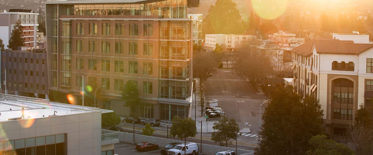 Sunset view of the buildings in the downtown skyline of Redwood City, California, USA.