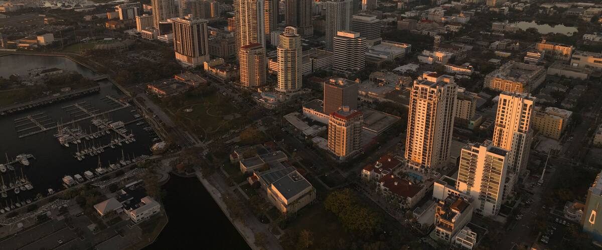 Aerial view of vibrant downtown skyline with marina and pier at sunset, St. Petersburg, Florida, United States.