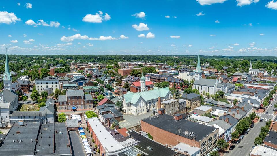 Aerial view Fredericksburg Virginia with Circuit Court building , historic business district, Baptist church, Chatham bridge over Rappahannock River