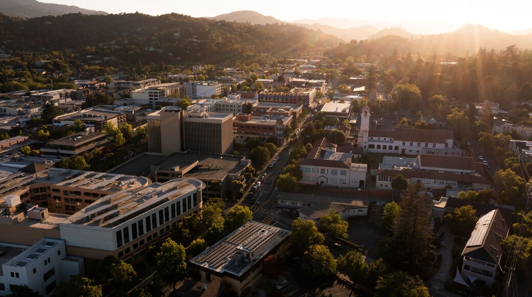 Sunset light shines on the historic Spanish Colonial mission and downtown skyline of San Rafael, California, USA.