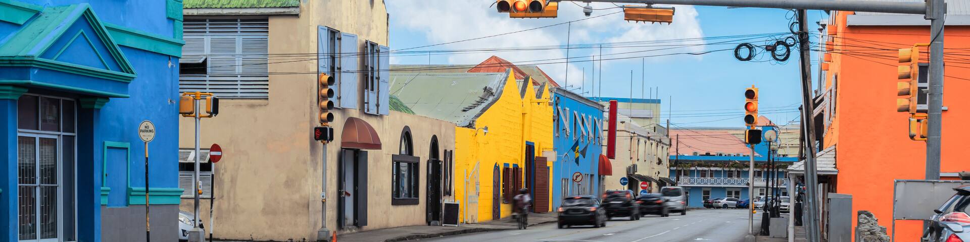 Traffic street and colorful buildings in city centre of Bridgetown, Barbados.