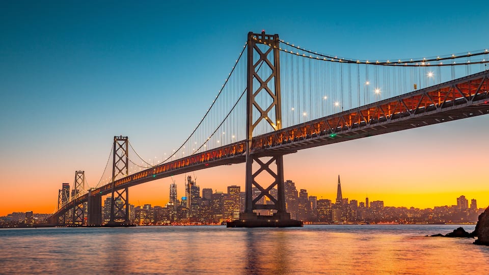 San Francisco skyline with Bay Bridge at sunset, California, USA