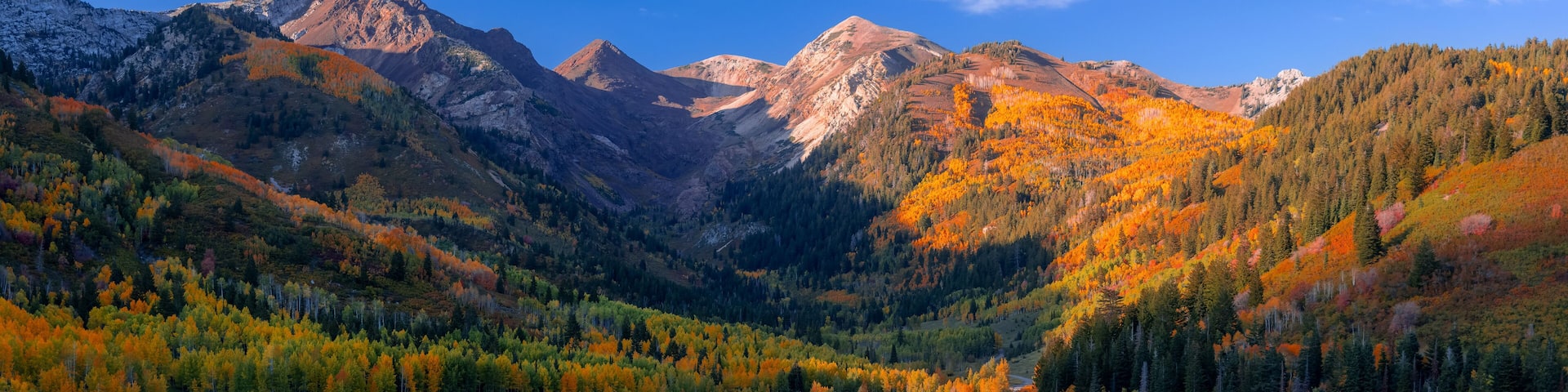 Scenic Silver lake reservoir landscape in Utah, Wasatch mountain range, under evening sunlight.