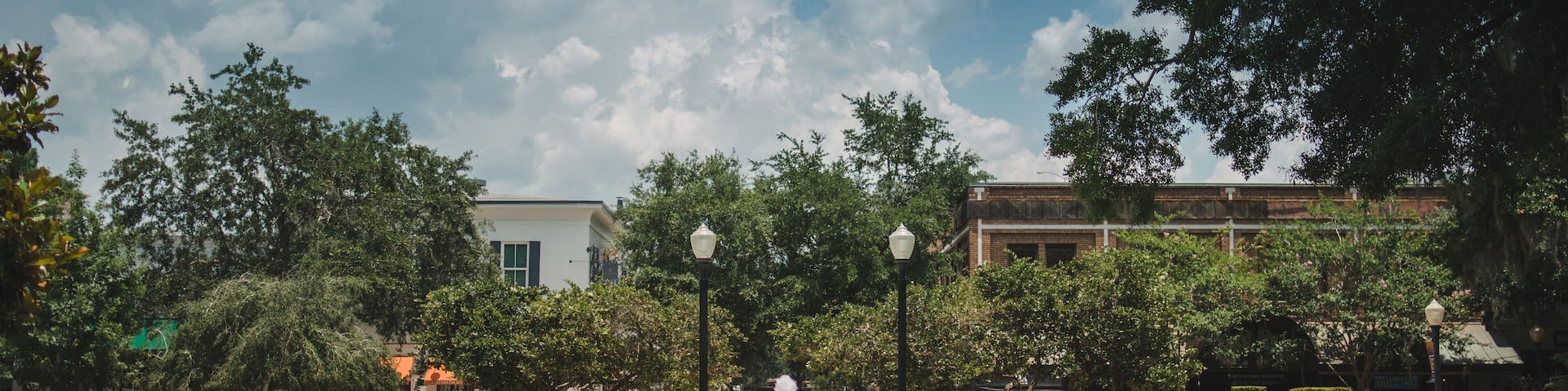 fountain in Winter Park is a city near Orlando, Florida. It’s known for its abundant outdoor spaces like leafy Central Park park avenue stock photo