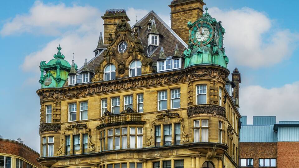 Emerson Chambers building in Newcastle City Centre featuring a copper enclosed clock on top.