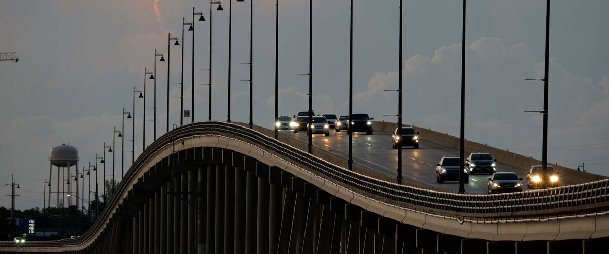 Barron Collier Bridge and Gilchrist Bridge in Florida with moving traffic. Transportation infrastructure in Charlotte County connecting Punta Gorda and Port Charlotte over Peace River