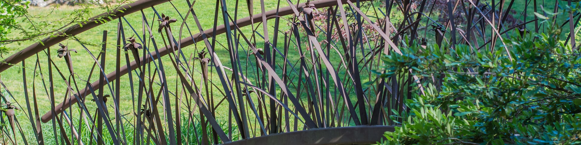 Artistic bridge in green lush garden setting. Sarah P. Duke gardens in Durham, NC.