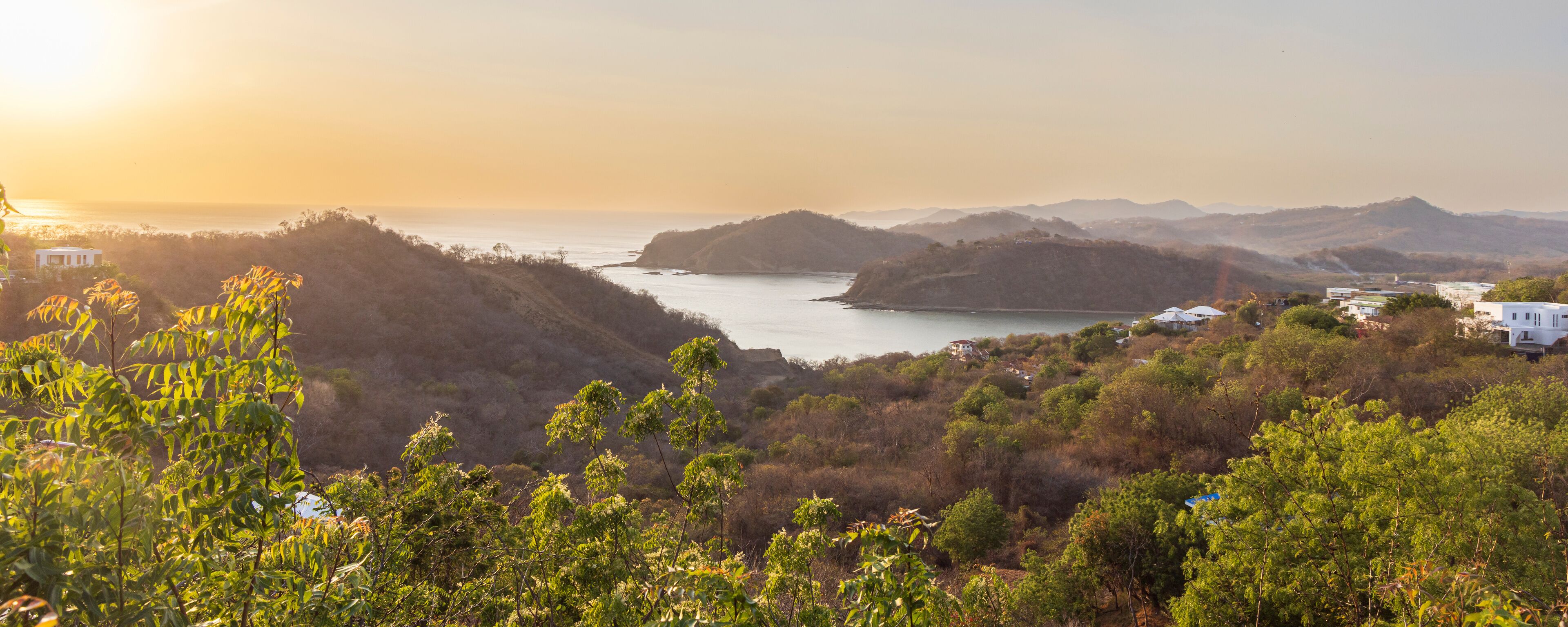 High point panoramic view from Christ of the Mercy statue standing on a cliff above the bay of San Juan del Sur in Nicaragua.