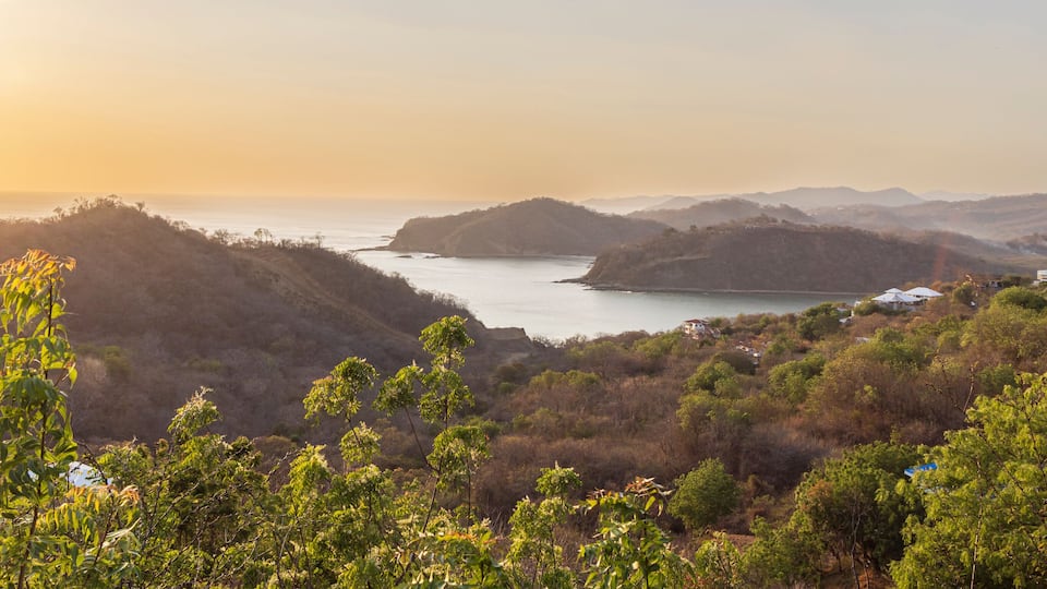 High point panoramic view from Christ of the Mercy statue standing on a cliff above the bay of San Juan del Sur in Nicaragua.