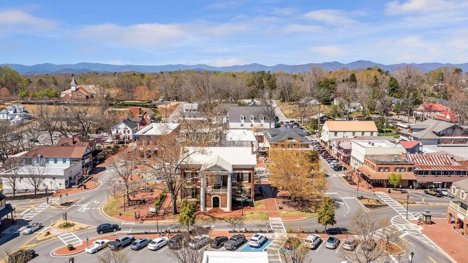 Aerial Photo of city center of small Georgia Mountain Town with Blue Ridge Mountains in the background